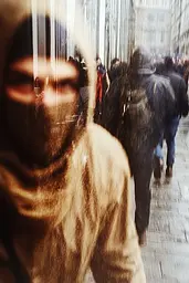 Midjourney generated image using SREF code Rustlight: A blurry image of people walking down a city street.
