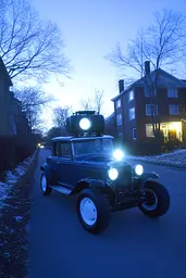 Midjourney generated image using SREF code Haloed Spectres: A vintage car parked on the side of a road.