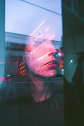 Midjourney generated image using SREF code Cyan Flux: A woman looking out of a window at the city.
