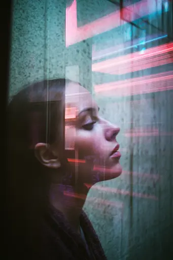 Midjourney generated image using SREF code Cyan Flux: A woman looking out of a window at a neon sign.