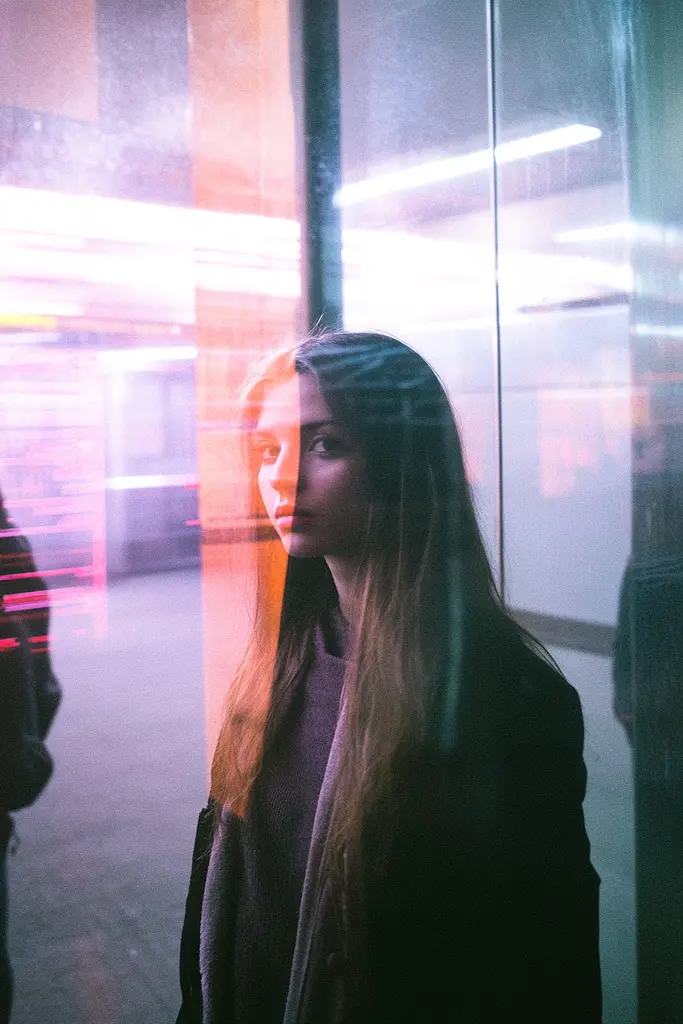 Midjourney generated image using SREF code Cyan Flux: A woman standing in front of a glass wall.