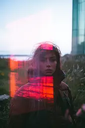 Midjourney generated image using SREF code Cyan Flux: A woman standing in a field of tall grass.