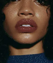 Midjourney generated image using SREF code Gossamer Gaze, Ominous Alienscape, Ethereal Echoes: a close up of a woman's face with glitter on her lips