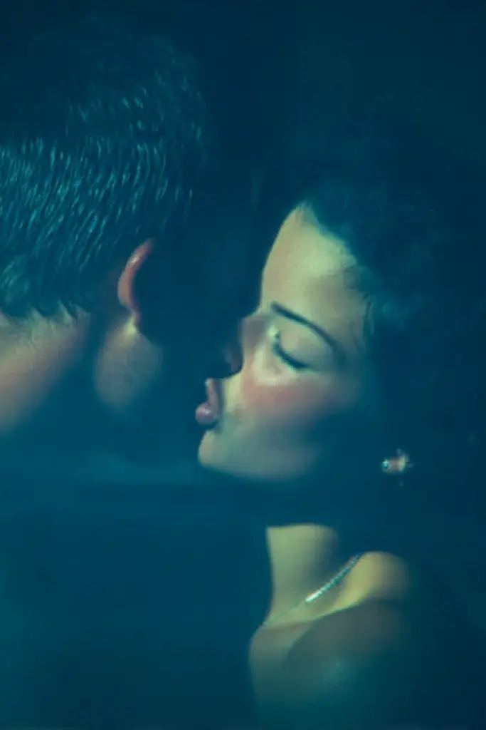 Midjourney generated image using SREF code Blue Velvet: A man and a woman kissing in the dark.