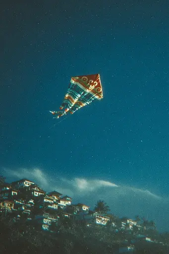 Midjourney generated image using SREF code Blue Velvet: A colorful kite flying in the sky over a city.