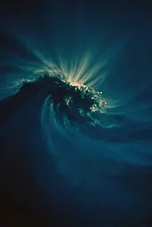 Midjourney generated image using SREF code Blue Velvet: A large wave in the middle of the ocean at night.