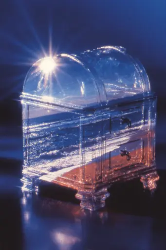 Midjourney generated image using SREF code Phosplasm: A clear glass chest with a light shining through it.