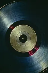 Midjourney generated image using SREF code Nebuloom: A close up of a vinyl record on a black background.
