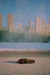 Midjourney generated image using SREF code Hushed Loomlight: A person laying on the ground in front of a city skyline.