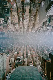 Midjourney generated image using SREF code Hushed Loomlight: A view of a city from the top of a skyscraper.