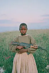 Midjourney generated image using SREF code Hushed Loomlight: A young girl holding a rifle in a field.