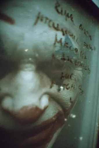 Midjourney generated image using SREF code Glitchmorose: A close up of a baby's face in a glass container.