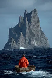 Midjourney generated image using SREF code Pyrognome: A man in a small boat in front of a large rock formation.