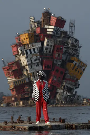 Midjourney generated image using SREF code Pyrognome: A man in a polka dot suit and hat standing on a pier.