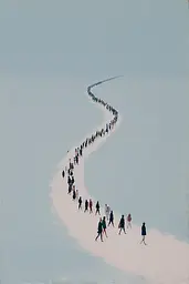 Midjourney generated image using SREF code Bluebone Drizzle: A group of people walking down a snow covered road.