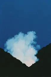 Midjourney generated image using SREF code Bluebone Drizzle: A cloud in the shape of a heart in the sky.