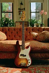 Midjourney generated image using SREF code Coppermuse: A bass guitar sitting on top of a couch in a living room.