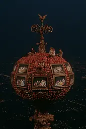 Midjourney generated image using SREF code Plushgrim: A large apple with a bunch of pictures on top of it.
