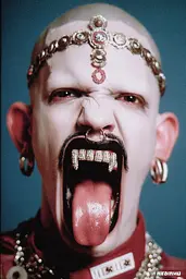 Midjourney generated image using SREF code GlimmerDial: A man with his tongue out and a crown on his head.