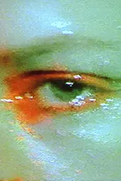 Midjourney generated image using SREF code Chromoshred: a close up of a person's eye with a green background