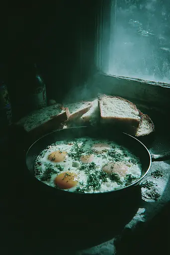 Midjourney generated image using SREF code Twilight Smog: A pan of eggs and bread sitting on a window sill.