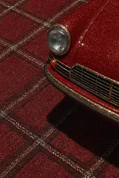 Midjourney generated image using SREF code Opaque Emberlock: A close up of the front end of a red car.