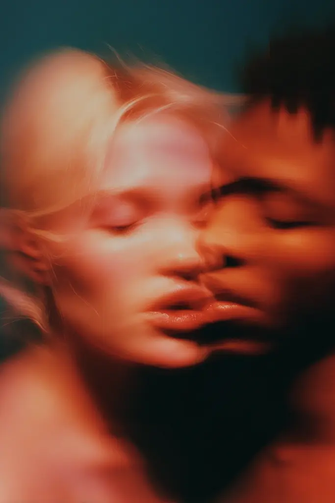 Midjourney generated image using SREF code Blurloom: A man and a woman are kissing in the dark.