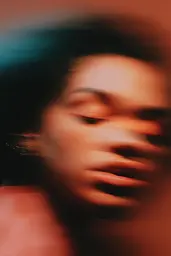 Midjourney generated image using SREF code Blurloom: a close up of a person with their eyes closed