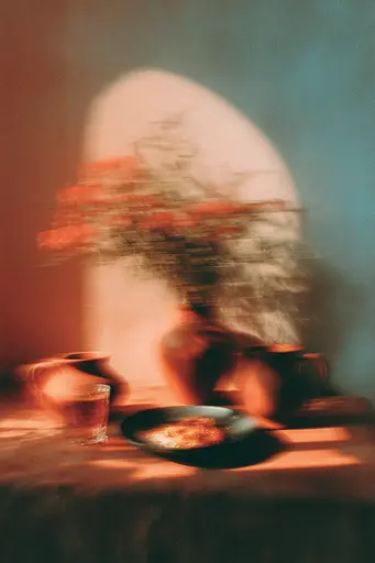 Midjourney generated image using SREF code Blurloom: A plate of food sitting on top of a table.