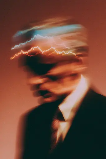 Midjourney generated image using SREF code Blurloom: A man in a suit and tie with a lightning bolt coming out of his head.