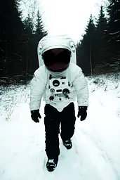 Midjourney generated image using SREF code Rebel Abyss: A man in an astronaut suit walking through the snow.