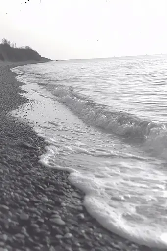 Midjourney generated image using SREF code Ethereal Dusk: A black and white photo of a beach with waves crashing on the shore.