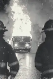 Midjourney generated image using SREF code Ethereal Dusk: A black and white photo of a fire truck on fire.