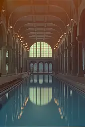 Midjourney generated image using SREF code Dreams of Leia: A large indoor swimming pool inside of a building.