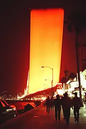 Midjourney generated image using SREF code Amber Memoirs: A group of people walking down a sidewalk at night.