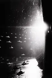 Midjourney generated image using SREF code Tonal Tales: A black and white photo of a large group of ships in the water.