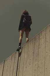 Midjourney generated image using SREF code Chiaroscuro Chronicles: A woman standing on top of a concrete wall.